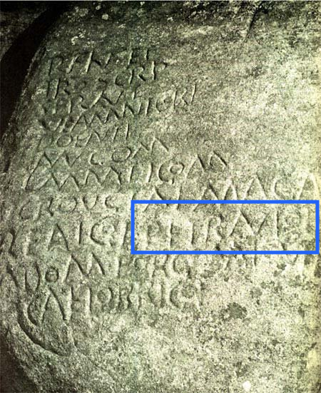 Rock carving with 'PETRANIOI' in Old Italic script.